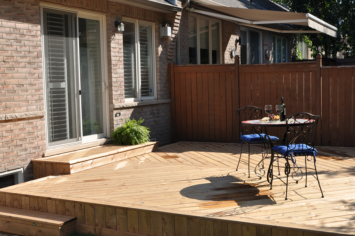 Wood deck with table and chairs. 
