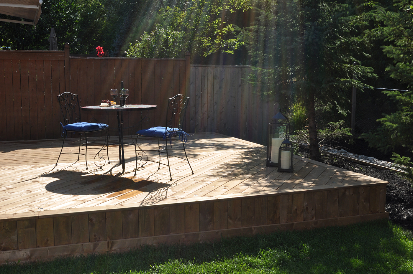 Sunlight on small wood deck.