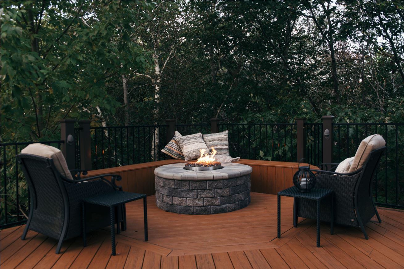 Composite deck and fire pit with unobstructed view of woodlands