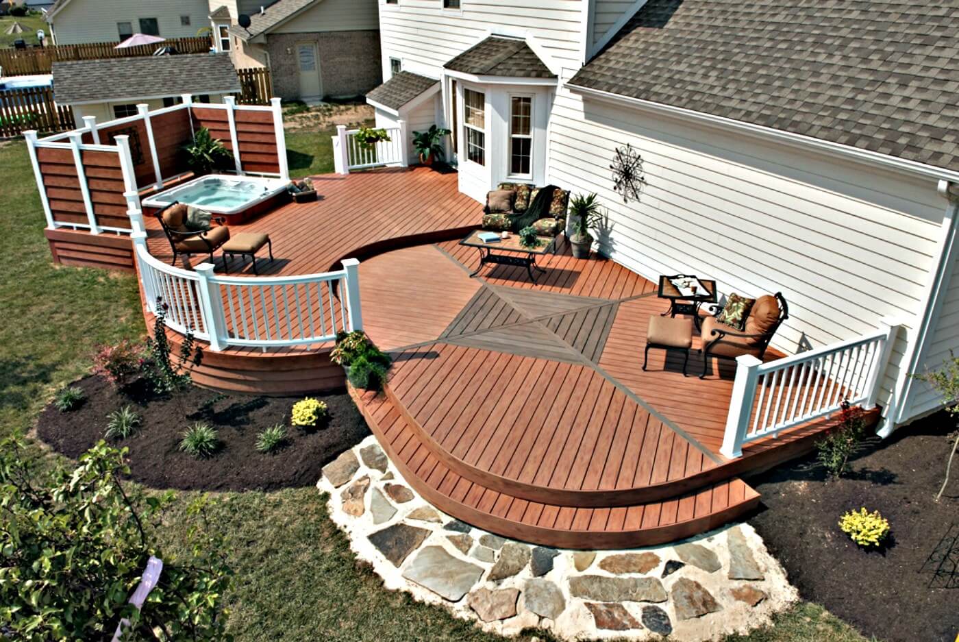 outdoor deck with spa and privacy fence