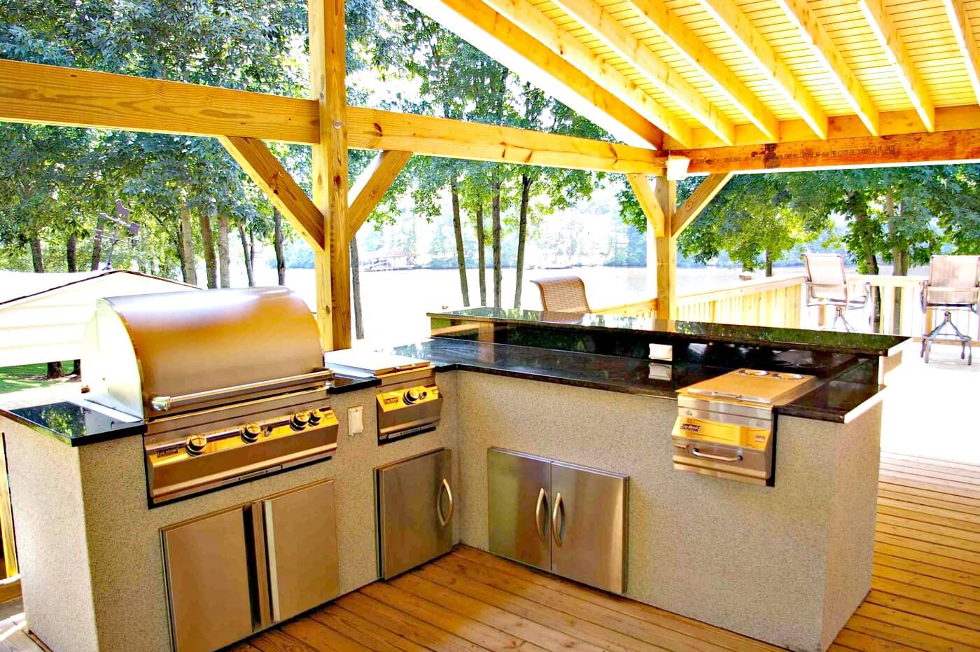 Custom outdoor kitchen on covered and deck