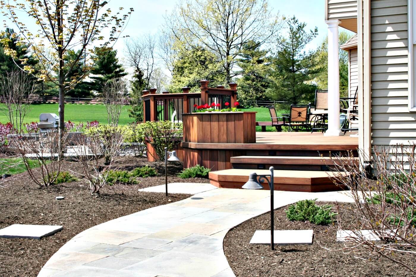 Custom backyard deck and patio with walkway