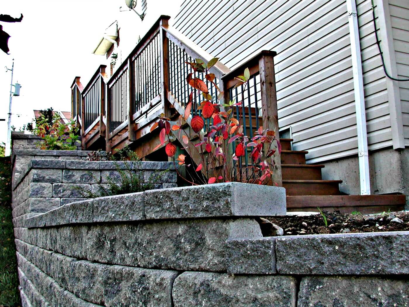 Stairs to Deck With Planters And Stone Walls