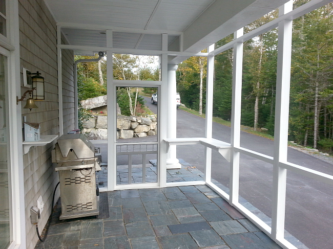 Screened porch and stone patio