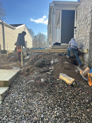 three men building a deck