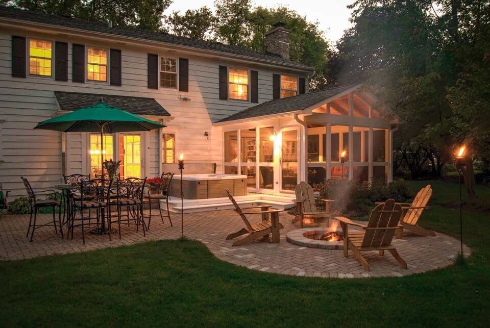 outdoor deck with hot tub and screened porch