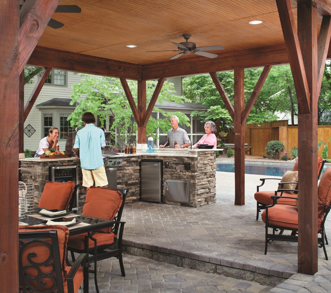 people enjoying new outdoor kitchen