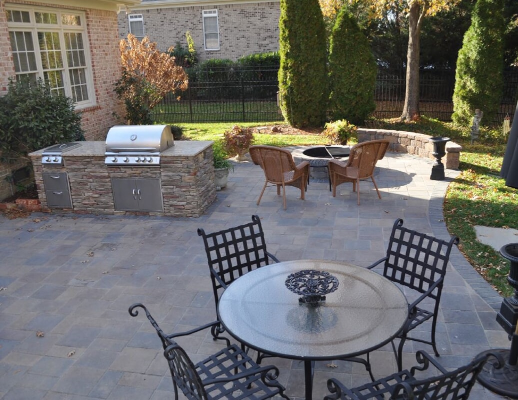 new outdoor kitchen with seating areas 