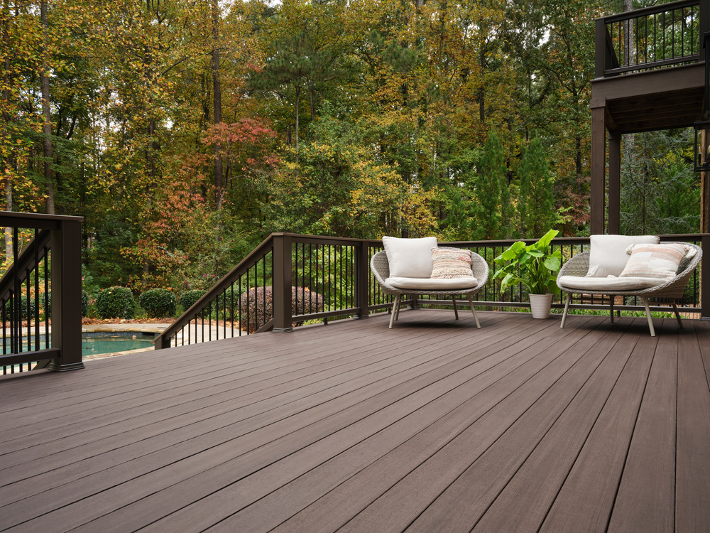 wooden deck with stairs leading to pool